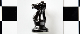 Knight chess piece on a pattern